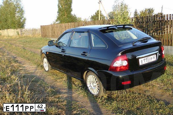 Фото автомобиля MITSUBISHI LANCER, 2012 — госномер Е111РР62. Цвет: ЧЕРНЫЙ