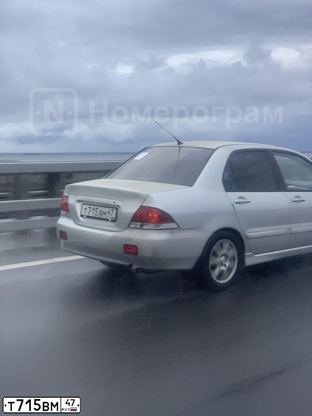 Фото автомобиля MITSUBISHI LANCER, 2005 — госномер Т715ВМ47. Цвет: СЕРЕБРИСТЫЙ