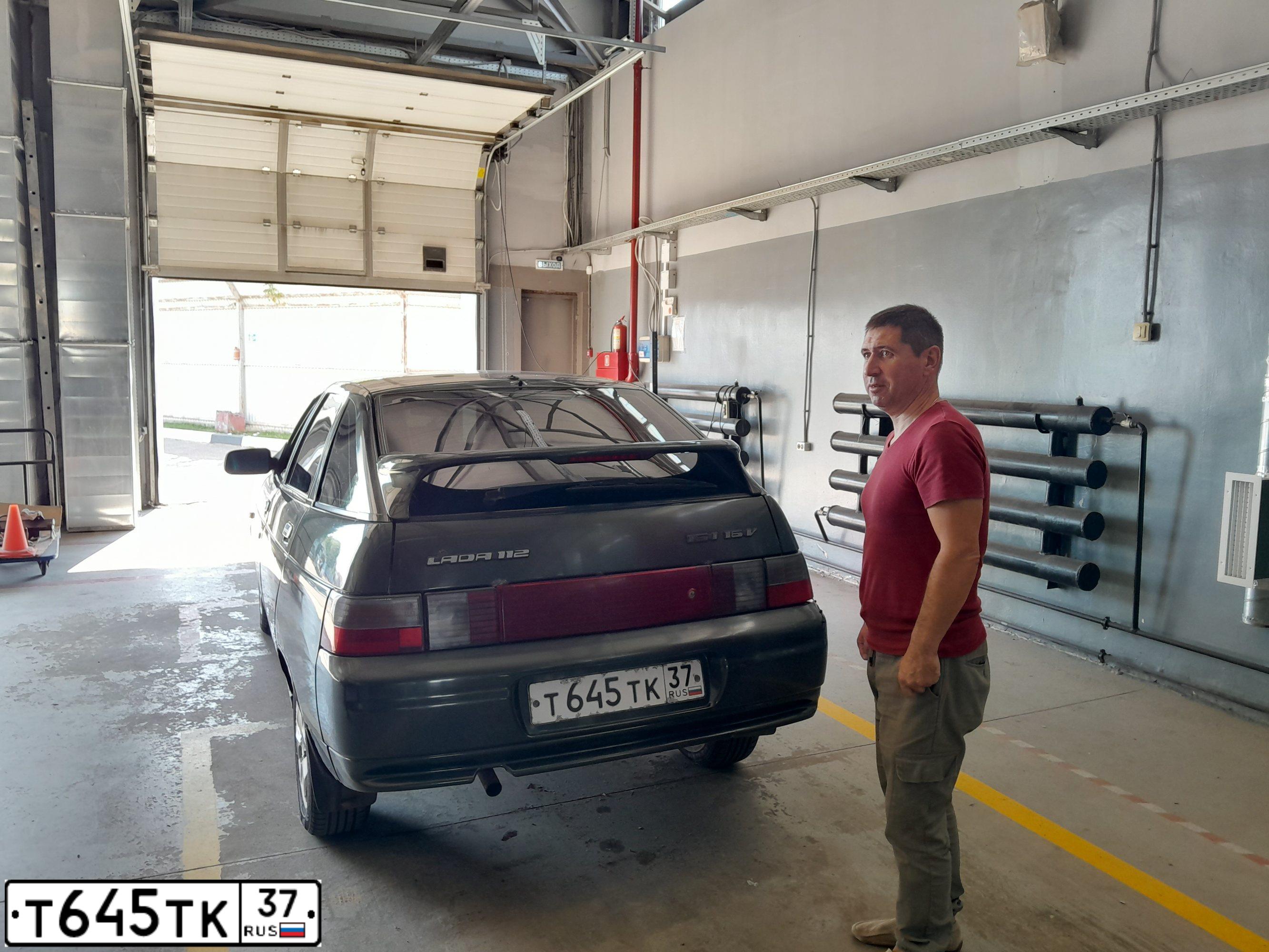 Фото автомобиля LADA 2112, 2005 — госномер В729АТ550. Цвет: ЗОЛОТИСТЫЙ ТЕМНО-ЗЕЛЕНЫЙ