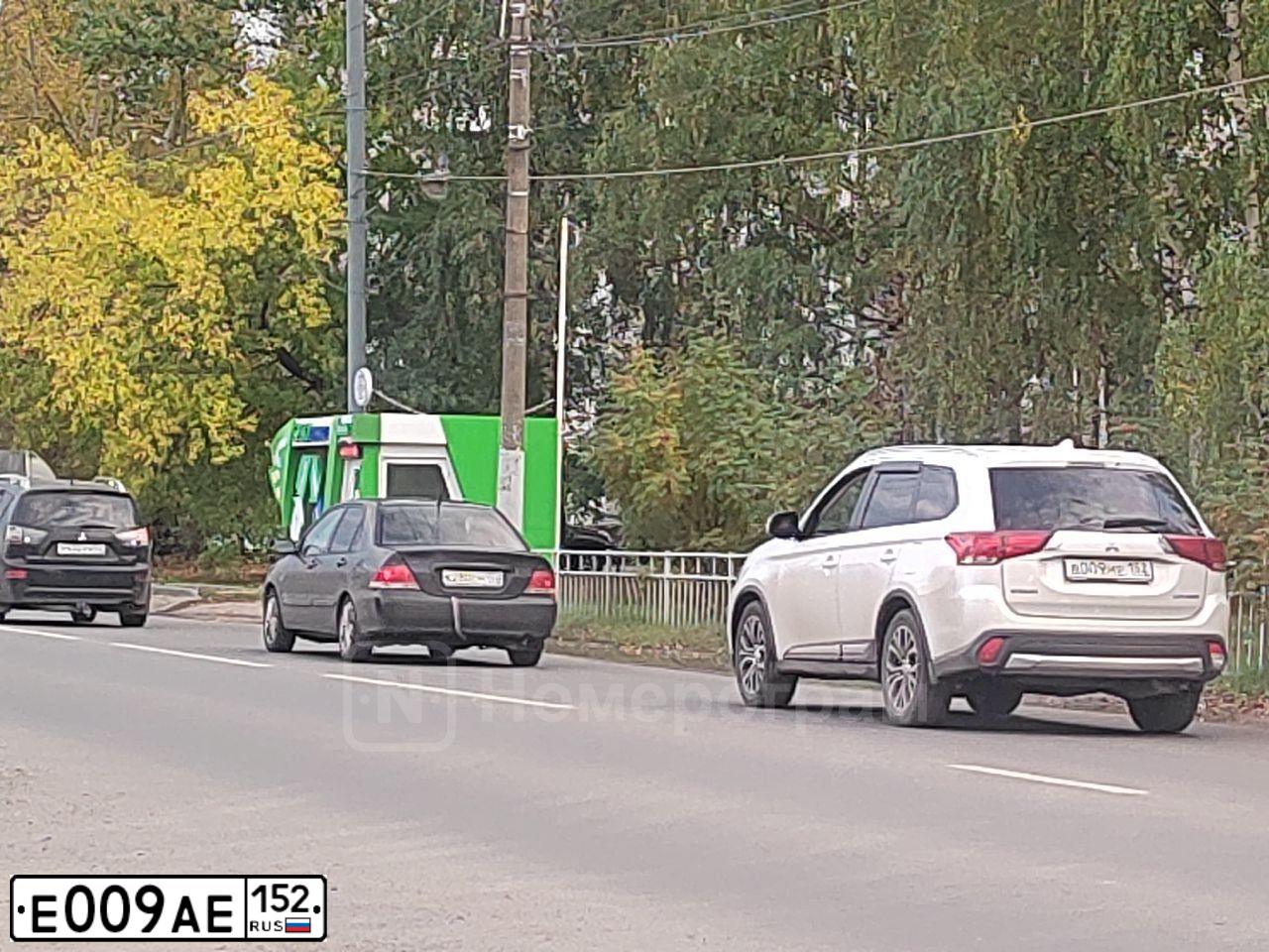 Фото автомобиля MAZDA CX-7, 2006 — госномер Е009АЕ152. Цвет: ЧЕРНЫЙ