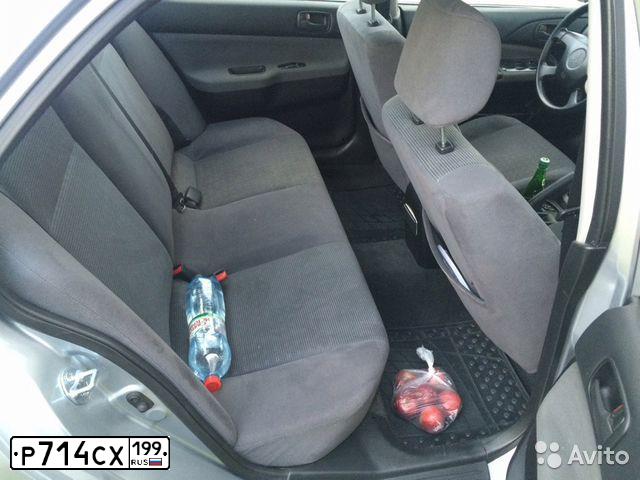 Фото автомобиля MITSUBISHI LANCER, 2003 — госномер Р165УА777. Цвет: Серый