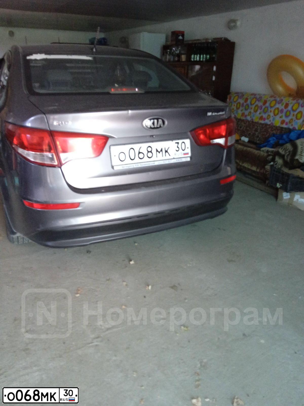 Фото автомобиля KIA RIO, 2015 — госномер О068МК30. Цвет: ТЕМНО-СЕРЫЙ