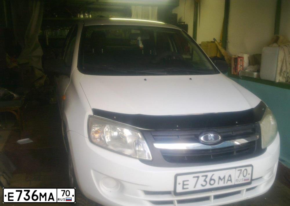 Фото автомобиля LADA 2190 GRANTA, 2012 — госномер Е736МА70. Цвет: Белый