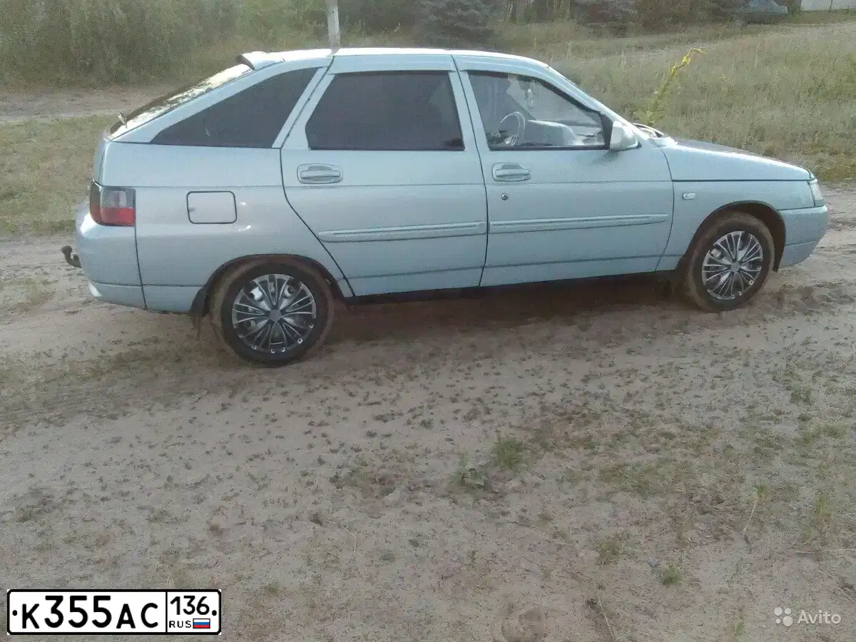 Фото автомобиля LADA 2112, 2002 — госномер Н090РХ36. Цвет: СЕРЕБРИСТО-ГОЛУБОЙ