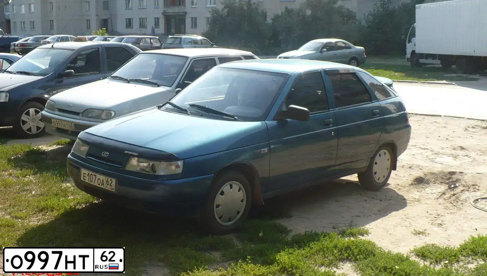 Фото автомобиля LADA 2114 SAMARA, 2005 — госномер К695ТО62. Цвет: Серебристо-желто-голубой