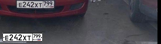 Фото автомобиля MITSUBISHI LANCER, 2004 — госномер Е242ХТ799. Цвет: Красный