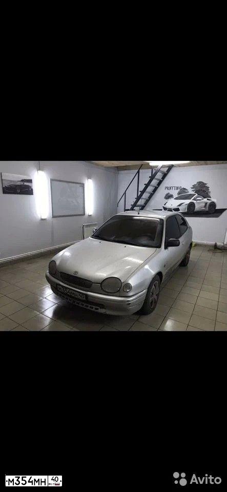 Фото автомобиля TOYOTA COROLLA, 1999 — госномер О266ХС40. Цвет: БЕЛЫЙ СЕРЕБРИСТЫЙ