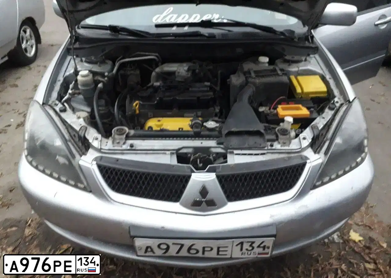 Фото автомобиля MITSUBISHI LANCER, 2006 — госномер М454ЕО34. Цвет: СЕРЕБРИСТЫЙ