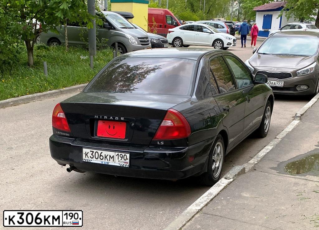 Фото автомобиля MITSUBISHI MIRAGE, 2000 — госномер К380АР250. Цвет: ЧЕРНЫЙ