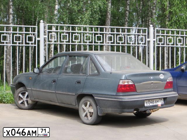 Фото автомобиля DAEWOO NEXIA, 2005 — госномер Х046АМ71. Цвет: СВЕТЛО-ЗЕЛЕНЫЙ