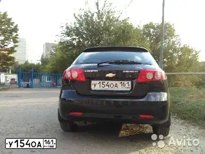 Фото автомобиля CHEVROLET LACETTI, 2011 — госномер У154ОА161. Цвет: ЧЕРНЫЙ