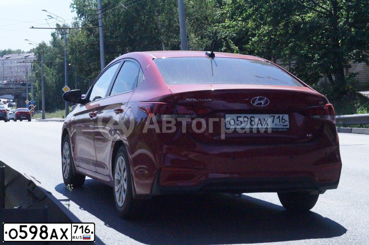Фото автомобиля HYUNDAI SOLARIS, 2018 — госномер О598АХ716. Цвет: КРАСНЫЙ
