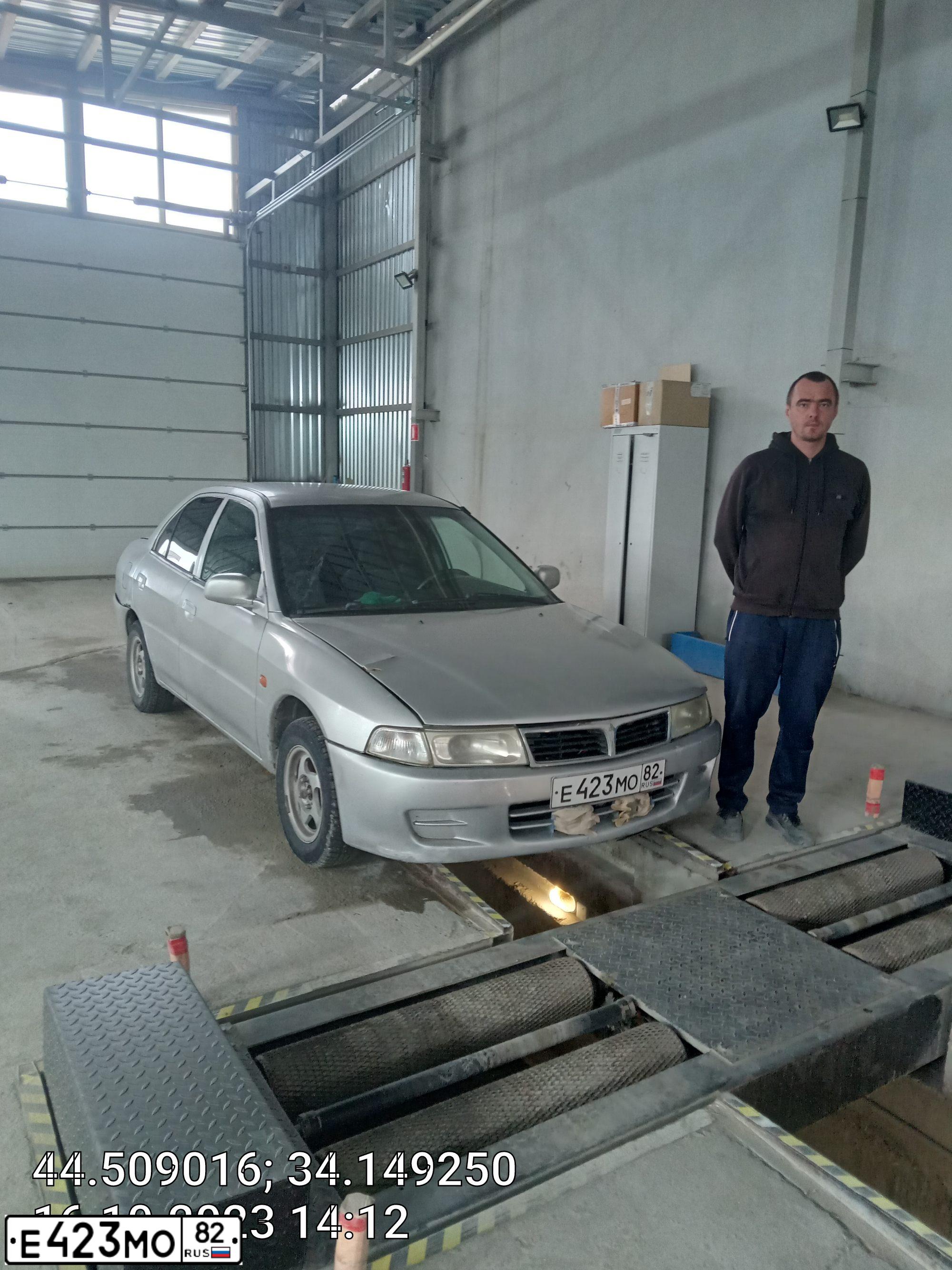 Фото автомобиля MITSUBISHI LANCER, 1998 — госномер Т247ТК97. Цвет: СЕРЫЙ