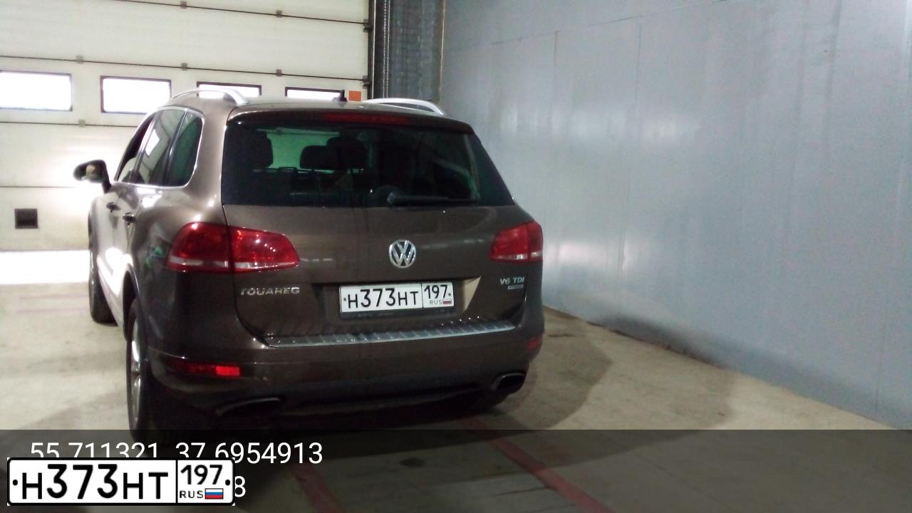 Фото автомобиля VOLKSWAGEN TOUAREG, 2011 — госномер Н373НТ197. Цвет: КОРИЧНЕВЫЙ