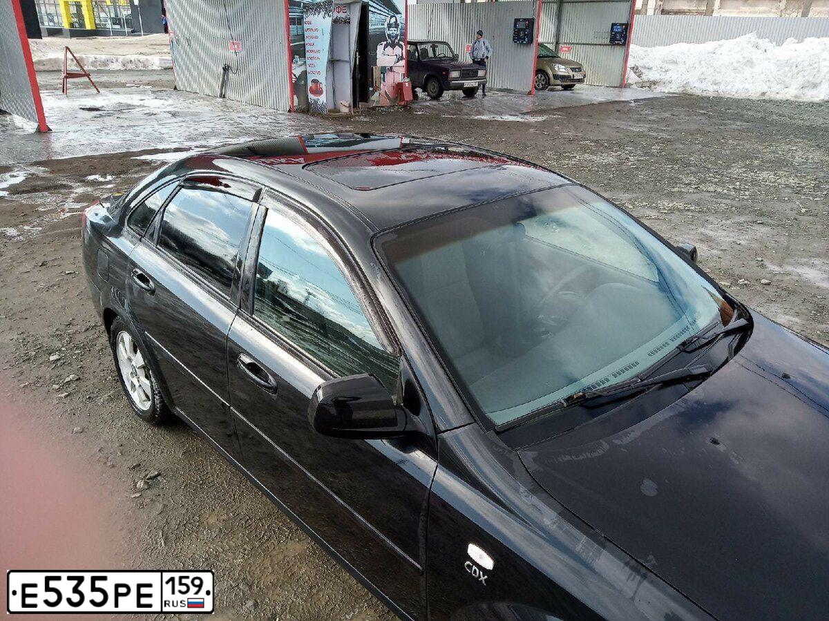 Фото автомобиля DAEWOO GENTRA, 2013 — госномер Н003ВМ159. Цвет: БЛЕДНО-ЧЕРНЫЙ