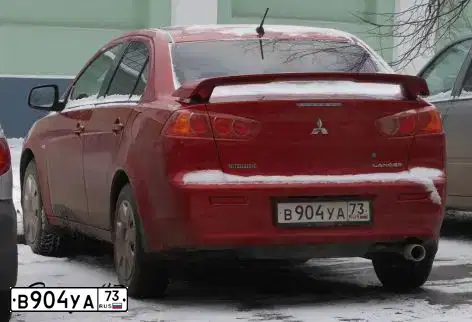 Фото автомобиля MITSUBISHI LANCER, 2007 — госномер В904УА73. Цвет: КРАСНЫЙ