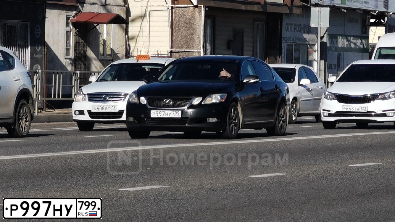 Фото автомобиля HYUNDAI GRAND STAREX, 2009 — госномер Р997НУ799. Цвет: Серый