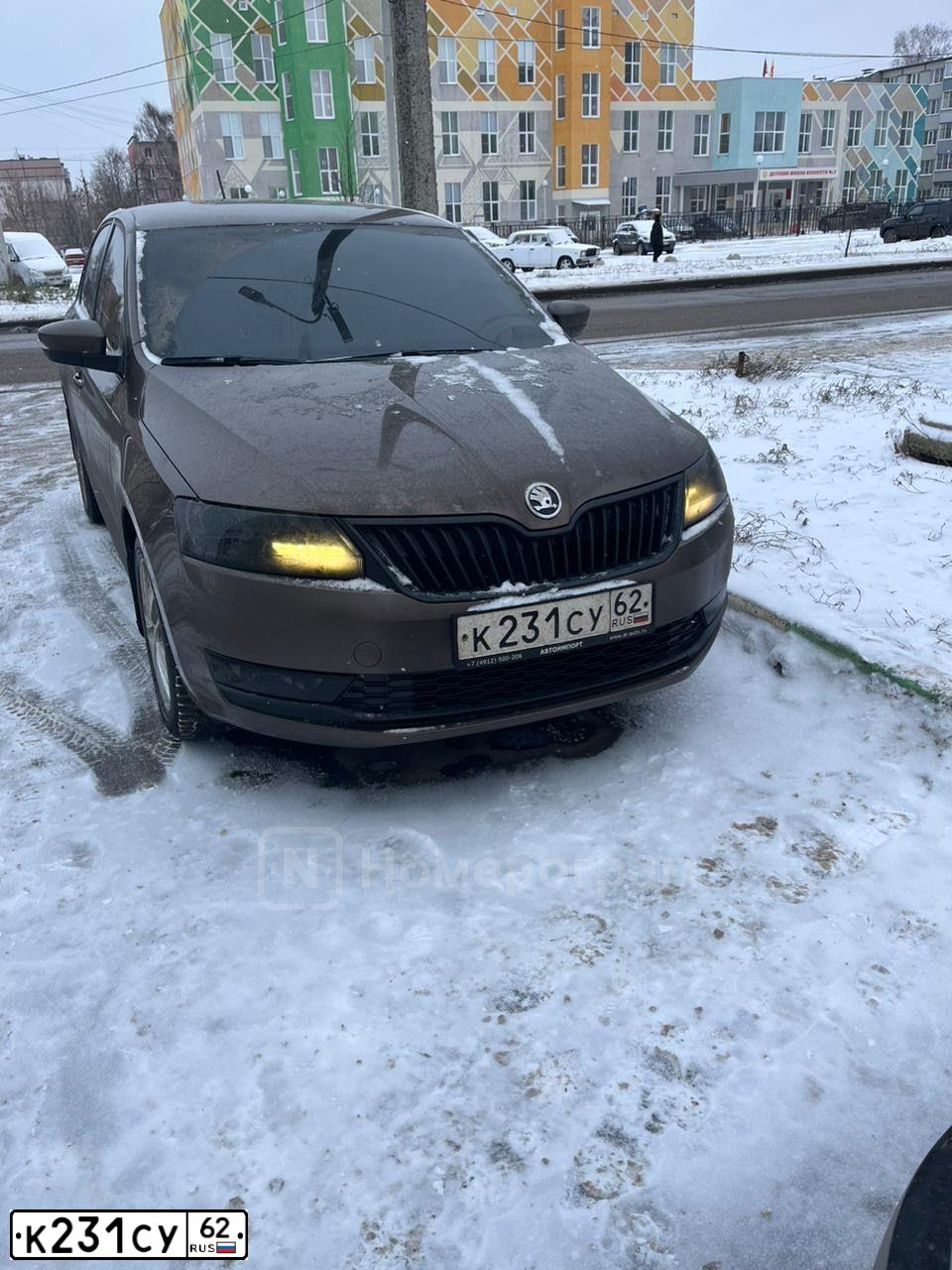Фото автомобиля SKODA RAPID, 2017 — госномер К231СУ62. Цвет: КОРИЧНЕВЫЙ