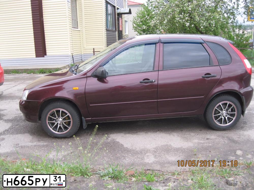 Фото автомобиля LADA 1119 KALINA, 2011 — госномер Н665РУ31. Цвет: ТЕМНО-ВИШНЕВЫЙ