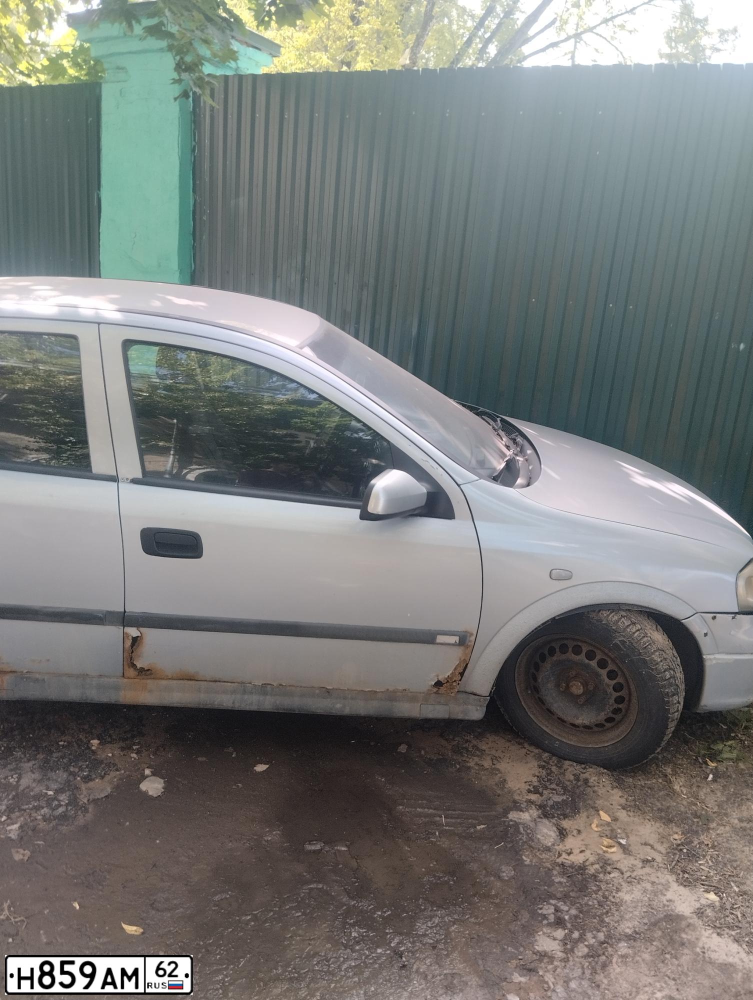 Фото автомобиля OPEL ASTRA, 1999 — госномер Н859АМ62. Цвет: Серый