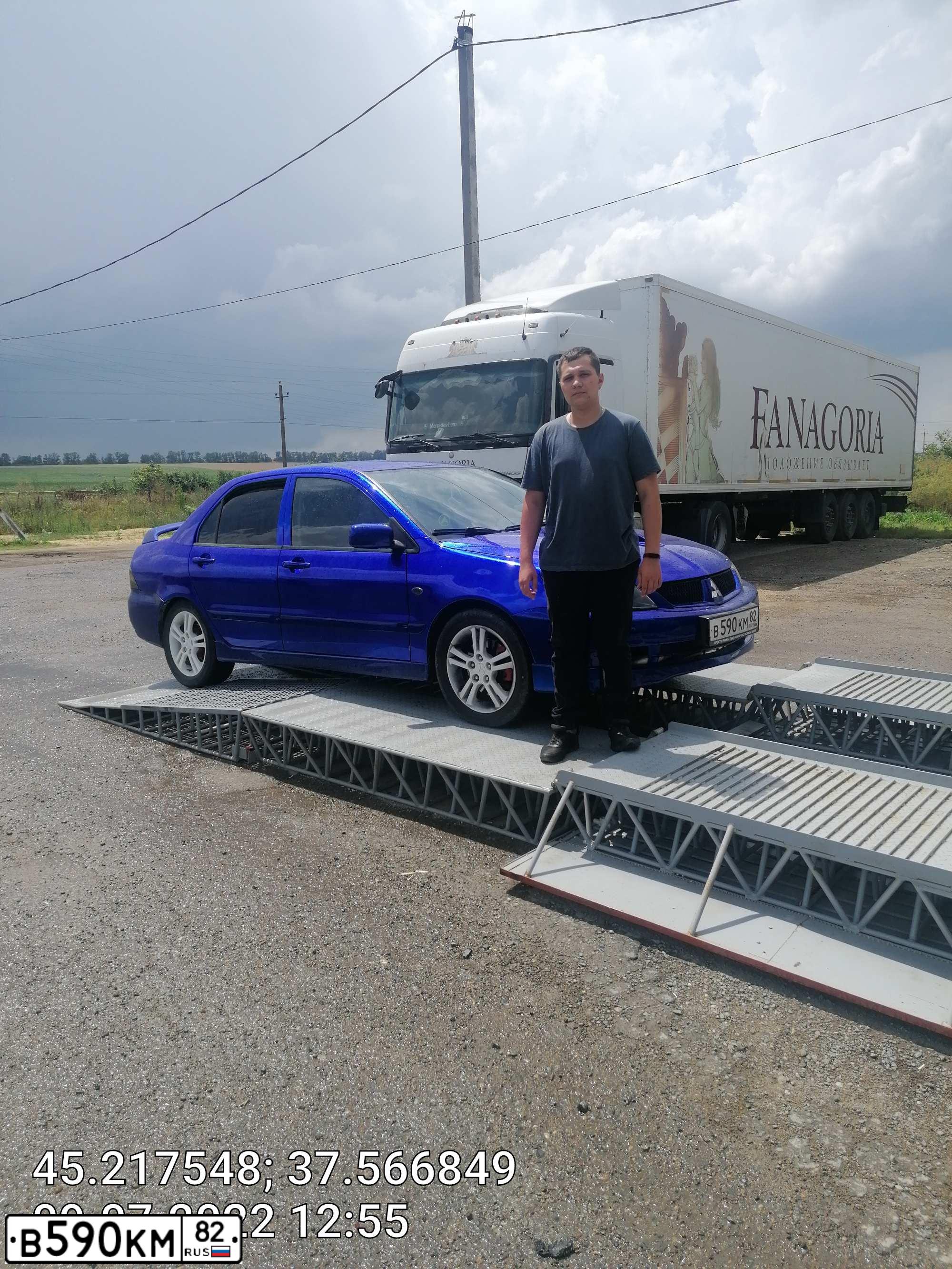 Фото автомобиля MITSUBISHI LANCER, 2006 — госномер М449ОК82. Цвет: СИНИЙ