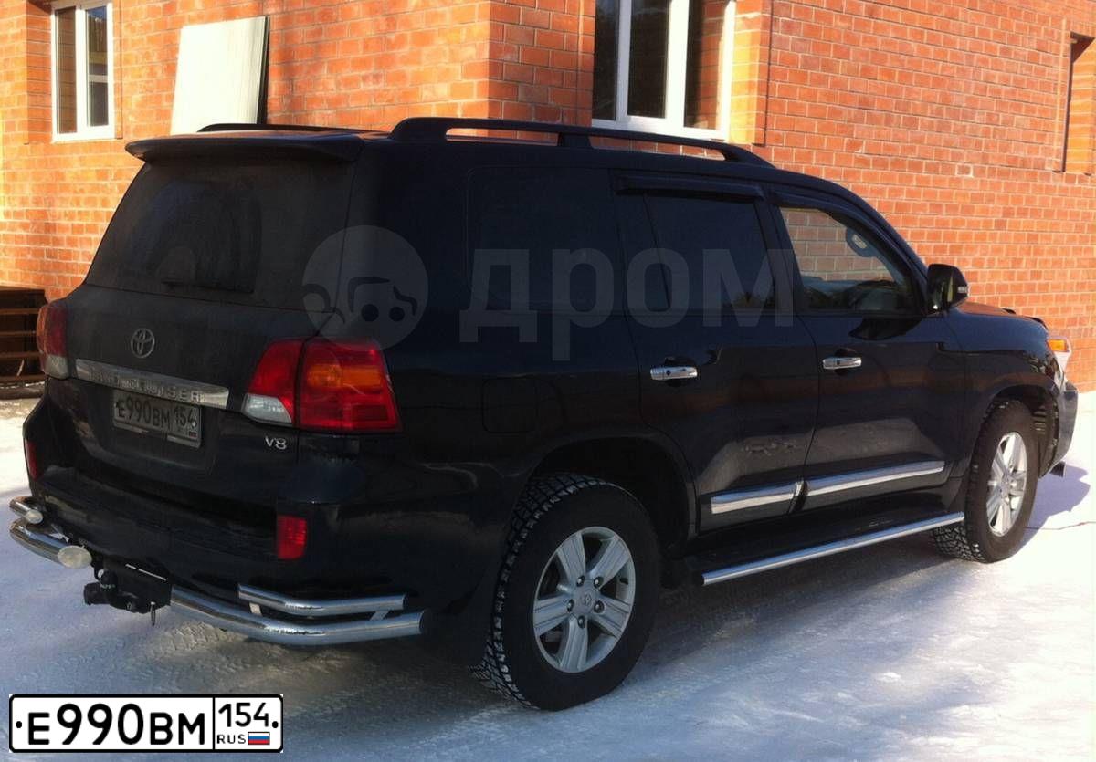 Фото автомобиля TOYOTA LANDCRUISER 200, 2012 — госномер В004ЕР35. Цвет: ЧЕРНЫЙ