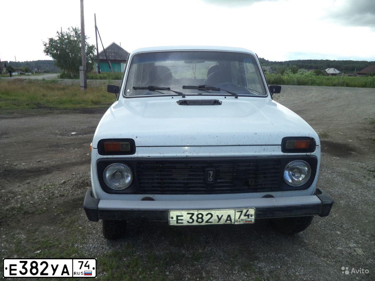 Фото автомобиля LADA 2121 NIVA, 2005 — госномер Е382УА74. Цвет: БЕЛЫЙ