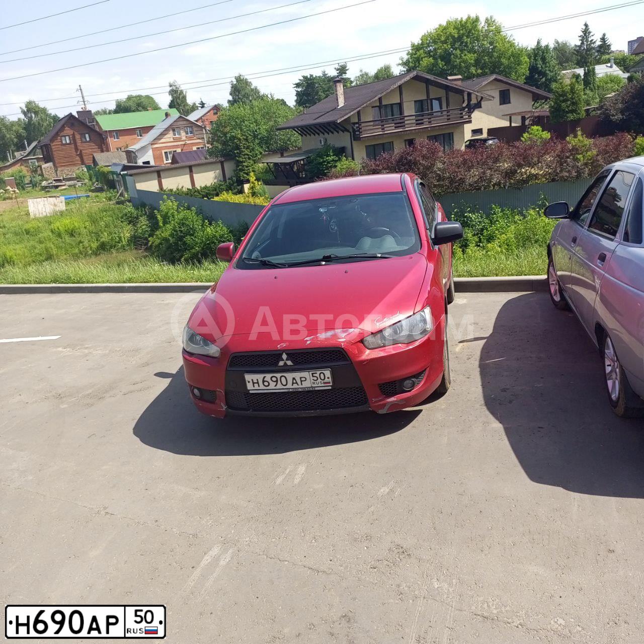 Фото автомобиля MITSUBISHI LANCER, 2008 — госномер Н690АР50. Цвет: Красный