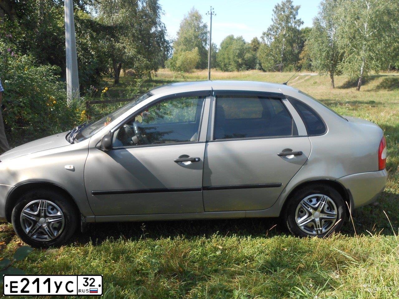Фото автомобиля LADA 1118 KALINA, 2006 — госномер Е211УС32. Цвет: БЕЖЕВО-СЕРЫЙ