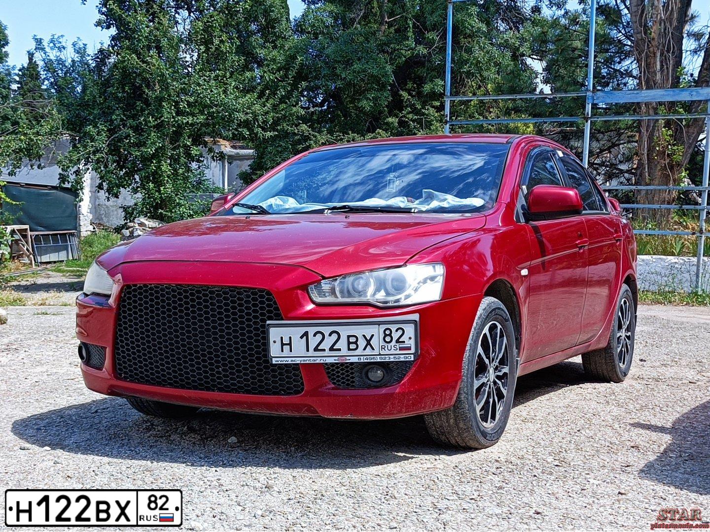 Фото автомобиля MITSUBISHI LANCER, 2008 — госномер Н122ВХ82. Цвет: Красный