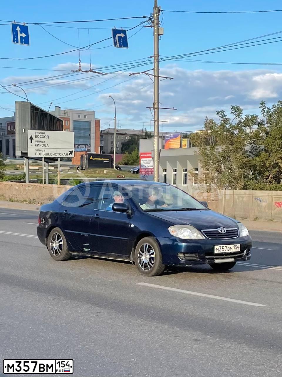 Фото автомобиля TOYOTA COROLLA, 2005 — госномер М357ВМ154. Цвет: ТЕМНО-СИНИЙ