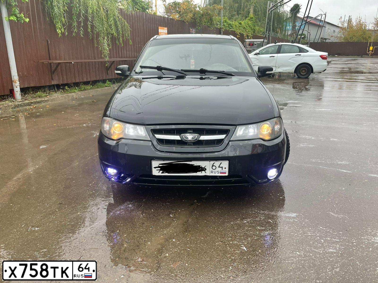 Фото автомобиля DAEWOO NEXIA, 2012 — госномер К193ТН164. Цвет: Бледно-Черный