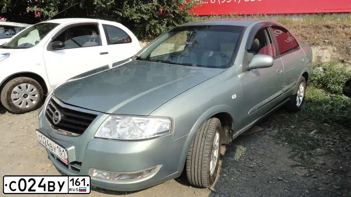 Фото автомобиля NISSAN ALMERA, 2007 — госномер Н850ОС761. Цвет: СЕРО-ЗЕЛЕНЫЙ