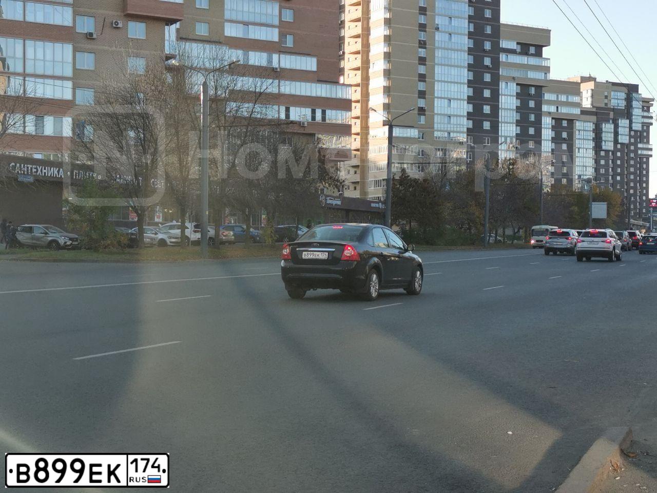 Фото автомобиля FORD FOCUS, 2008 — госномер В899ЕК174. Цвет: ЧЕРНЫЙ