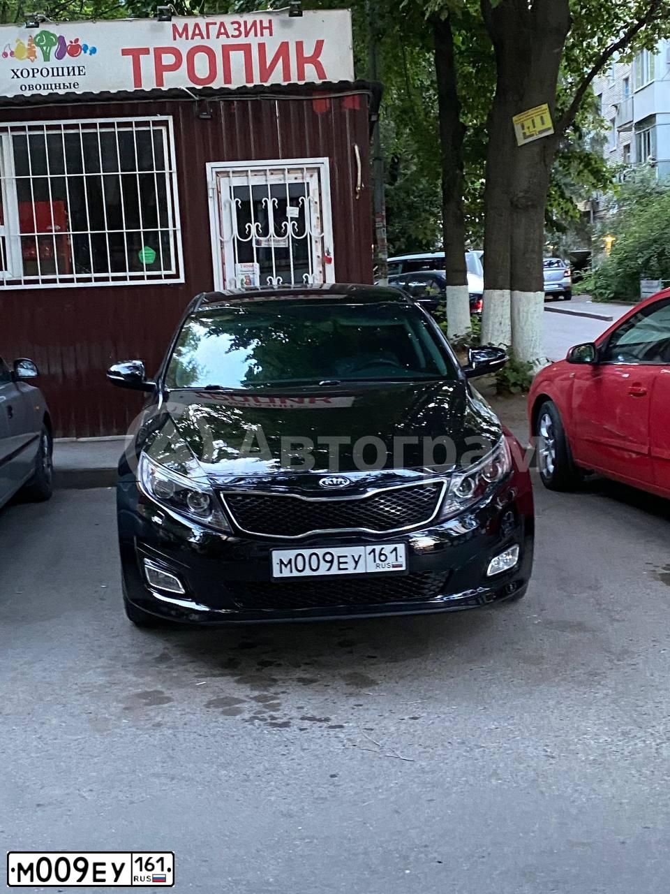 Фото автомобиля KIA MAGENTIS / OPTIMA, 2015 — госномер М009ЕУ161. Цвет: ЧЕРНЫЙ
