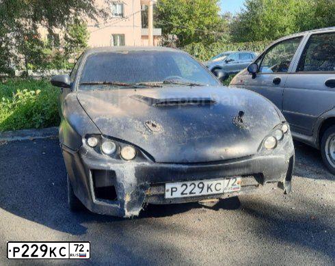Фото автомобиля HYUNDAI TIBURON, 1997 — госномер Р229КС72. Цвет: ЧЕРНЫЙ