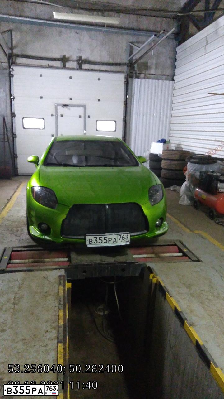 Фото автомобиля MITSUBISHI ECLIPSE, 2006 — госномер О646ВА716. Цвет: серебристо светло-зеленый
