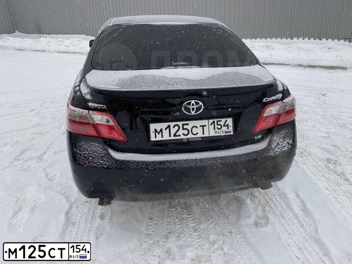 Фото автомобиля TOYOTA CAMRY, 2008 — госномер М125СТ154. Цвет: ЧЕРНЫЙ