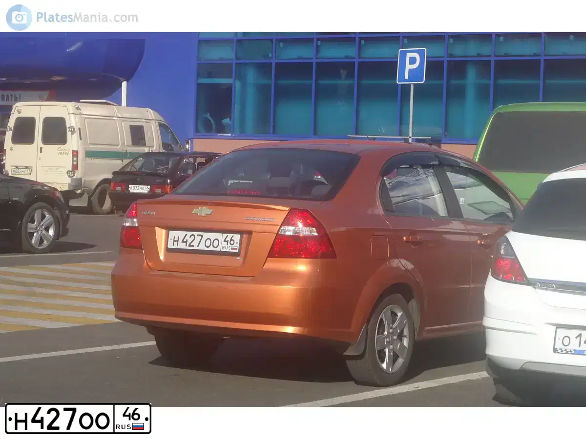 Фото автомобиля CHEVROLET AVEO, 2006 — госномер Н427ОО46. Цвет: ОРАНЖЕВЫЙ
