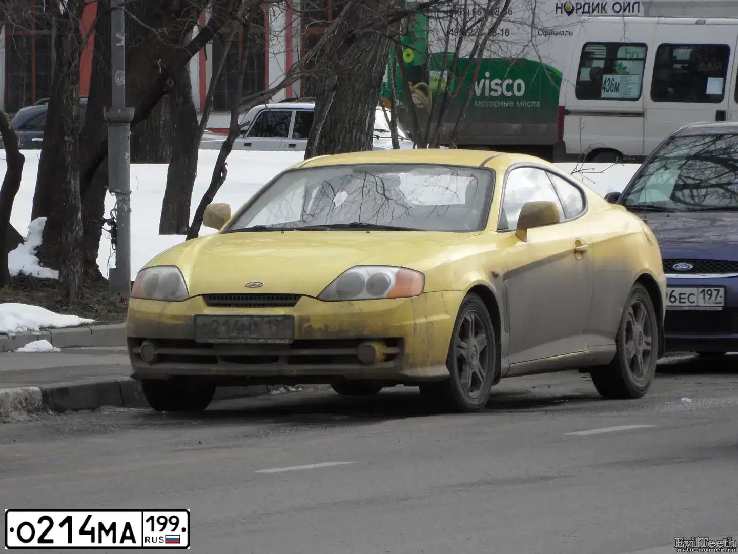 Фото автомобиля HYUNDAI /S-/COUPE / TUSCANI, 2004 — госномер Т322КМ77. Цвет: ЖЕЛТЫЙ