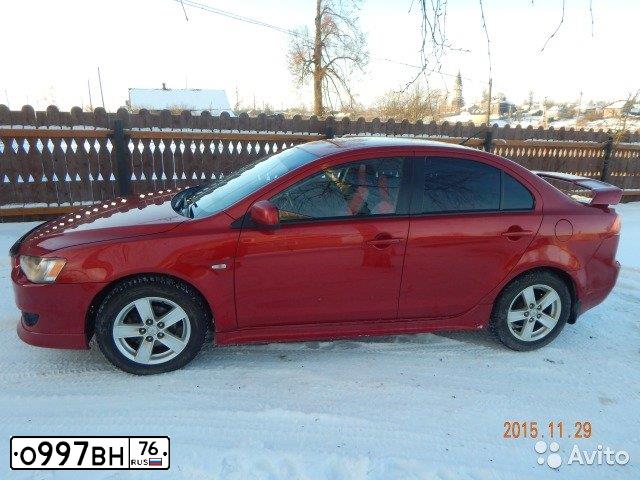 Фото автомобиля MITSUBISHI LANCER, 2007 — госномер О997ВН76. Цвет: КРАСНЫЙ