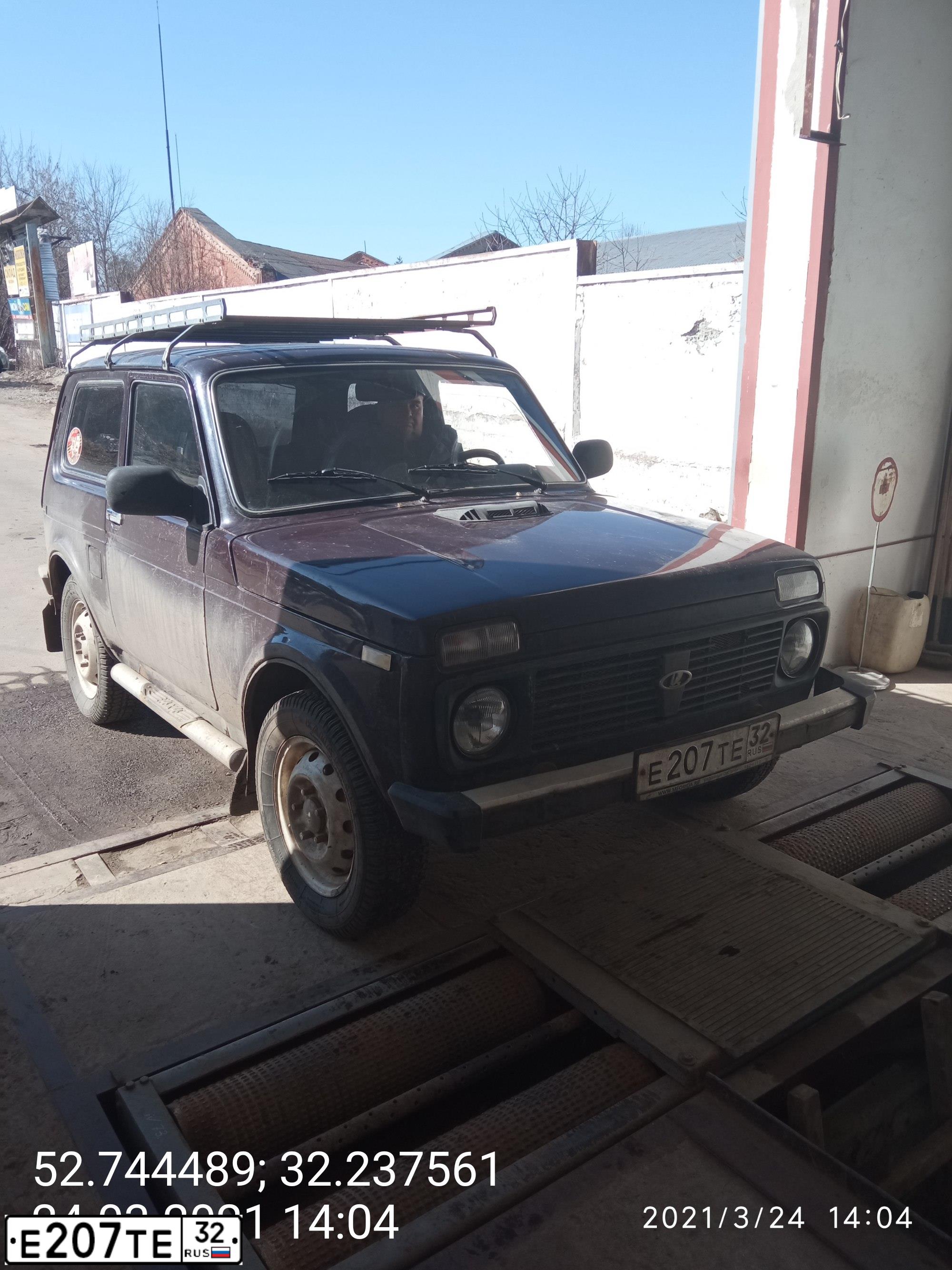 Фото автомобиля LADA 2121 NIVA, 2009 — госномер Е207ТЕ32. Цвет: ТЕМНО-КОРИЧНЕВЫЙ