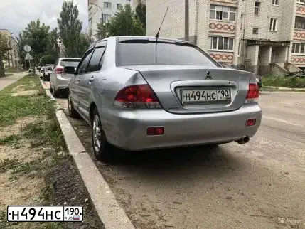 Фото автомобиля MITSUBISHI LANCER, 2006 — госномер Р125РО33. Цвет: СЕРЕБРИСТЫЙ