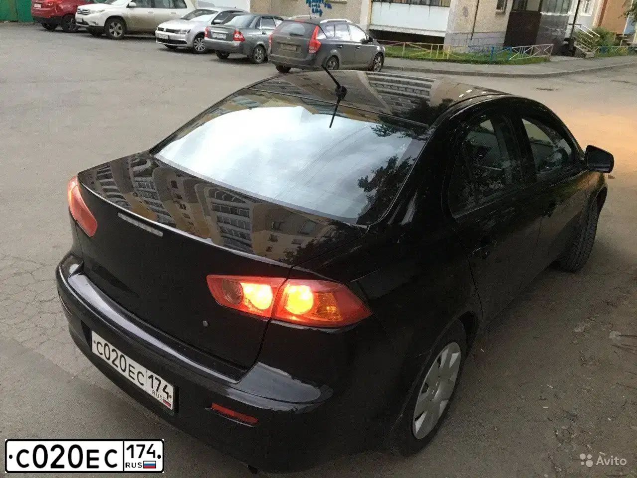 Фото автомобиля MITSUBISHI LANCER, 2008 — госномер С020ЕС174. Цвет: ЧЕРНЫЙ