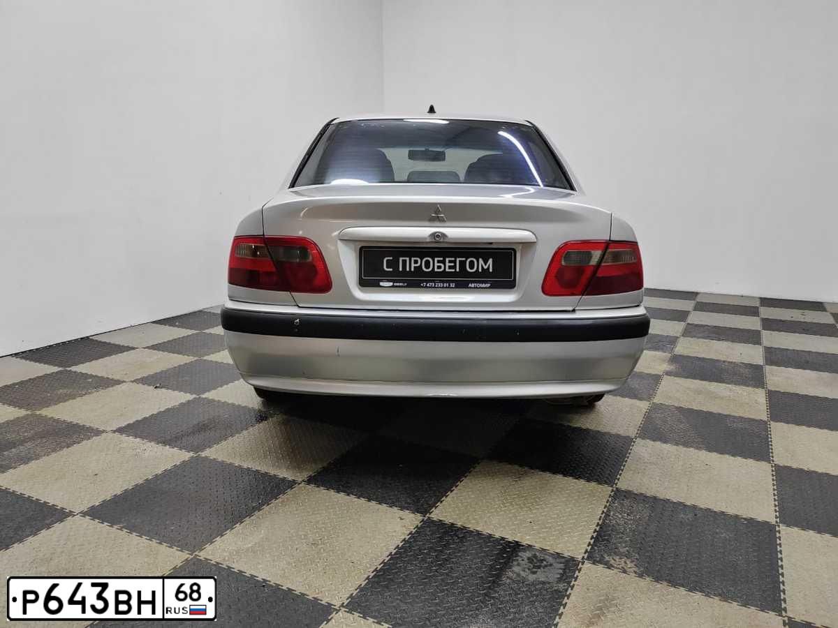 Фото автомобиля MITSUBISHI CARISMA, 2002 — госномер С436АР68. Цвет: СЕРЕБРИСТЫЙ