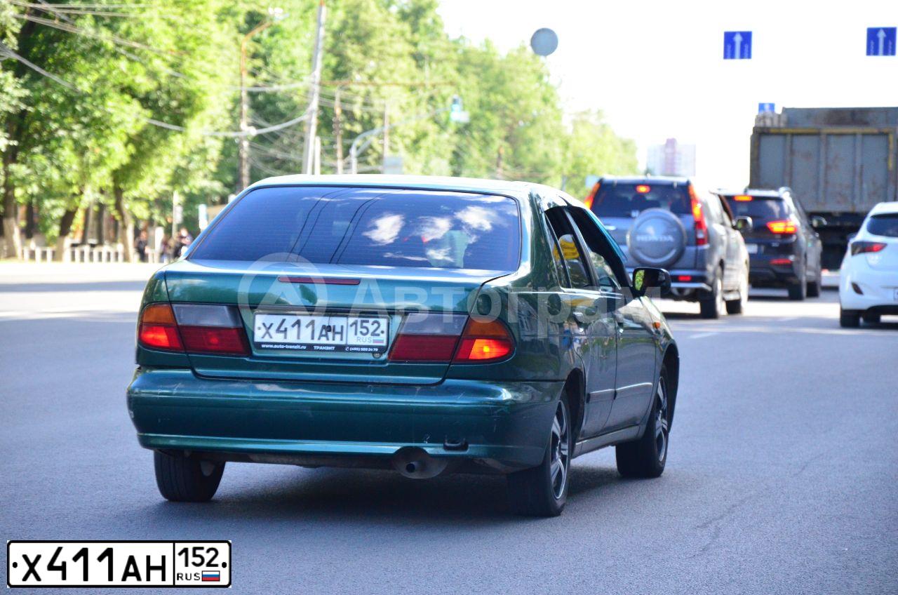 Фото автомобиля NISSAN ALMERA, 1997 — госномер К200РР199. Цвет: ЗЕЛЕНЫЙ