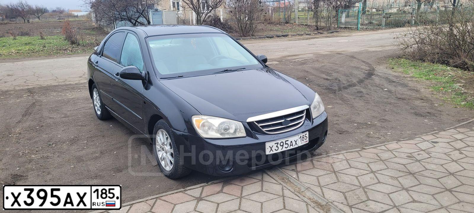Фото автомобиля KIA CERATO, 2005 — госномер Х395АХ185. Цвет: ЧЕРНЫЙ