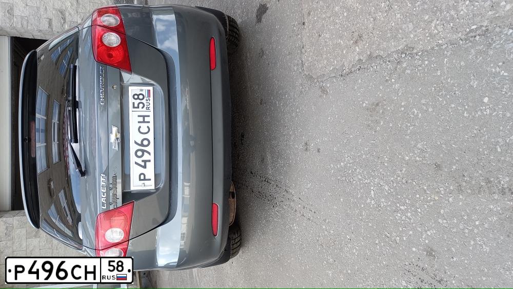 Фото автомобиля CHEVROLET LACETTI, 2012 — госномер Р496СН58. Цвет: Серый
