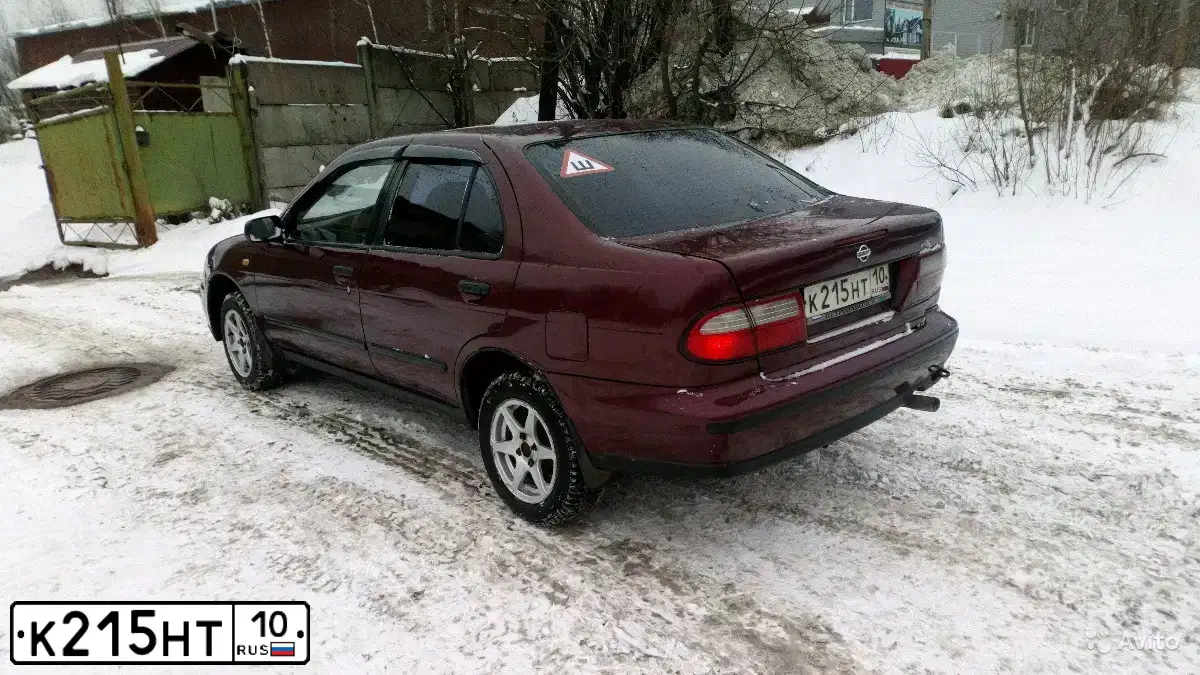Фото автомобиля NISSAN ALMERA, 1998 — госномер К215НТ10. Цвет: КРАСНЫЙ