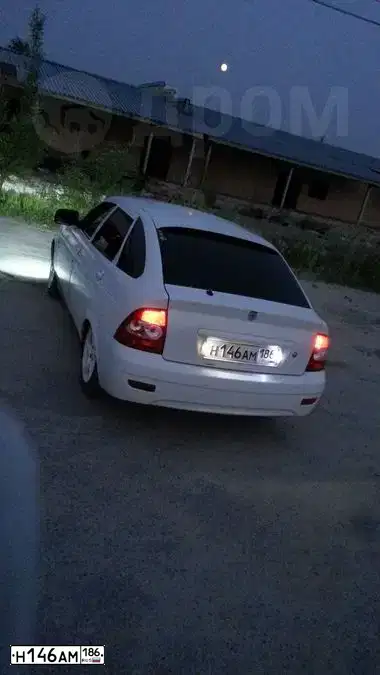 Фото автомобиля LADA 2172 PRIORA, 2012 — госномер Н146АМ186. Цвет: БЕЛЫЙ